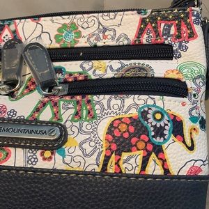 Stone Mountain leather bag. Use 4 ways! Elephant design, all straps included.